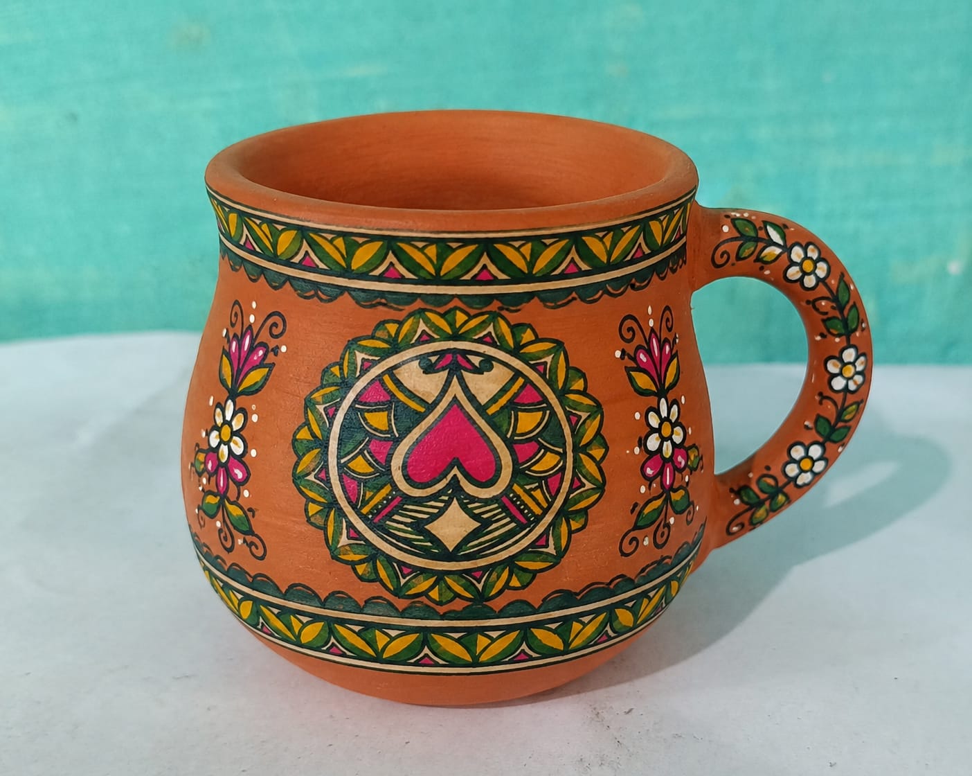 Terracotta mug with mandala heart motif
